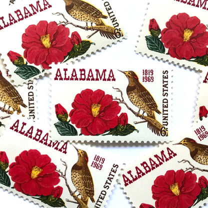 Image of Alabama Statehood postage stamps from 1969, featuring Alabama’s yellowhammer state bird and camellia state flower on vintage unused 6-cent USPS postage, Scott 1375.