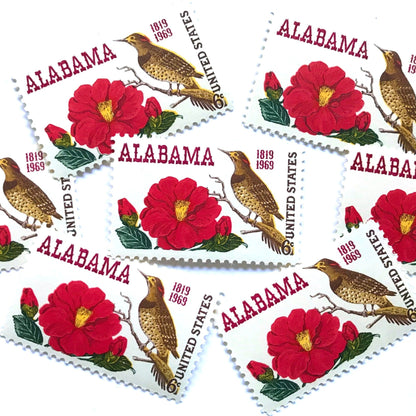 Image of Alabama Statehood postage stamps from 1969, featuring Alabama’s yellowhammer state bird and camellia state flower on vintage unused 6-cent USPS postage, Scott 1375.