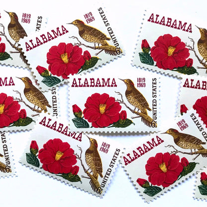 Image of Alabama Statehood postage stamps from 1969, featuring Alabama’s yellowhammer state bird and camellia state flower on vintage unused 6-cent USPS postage, Scott 1375.