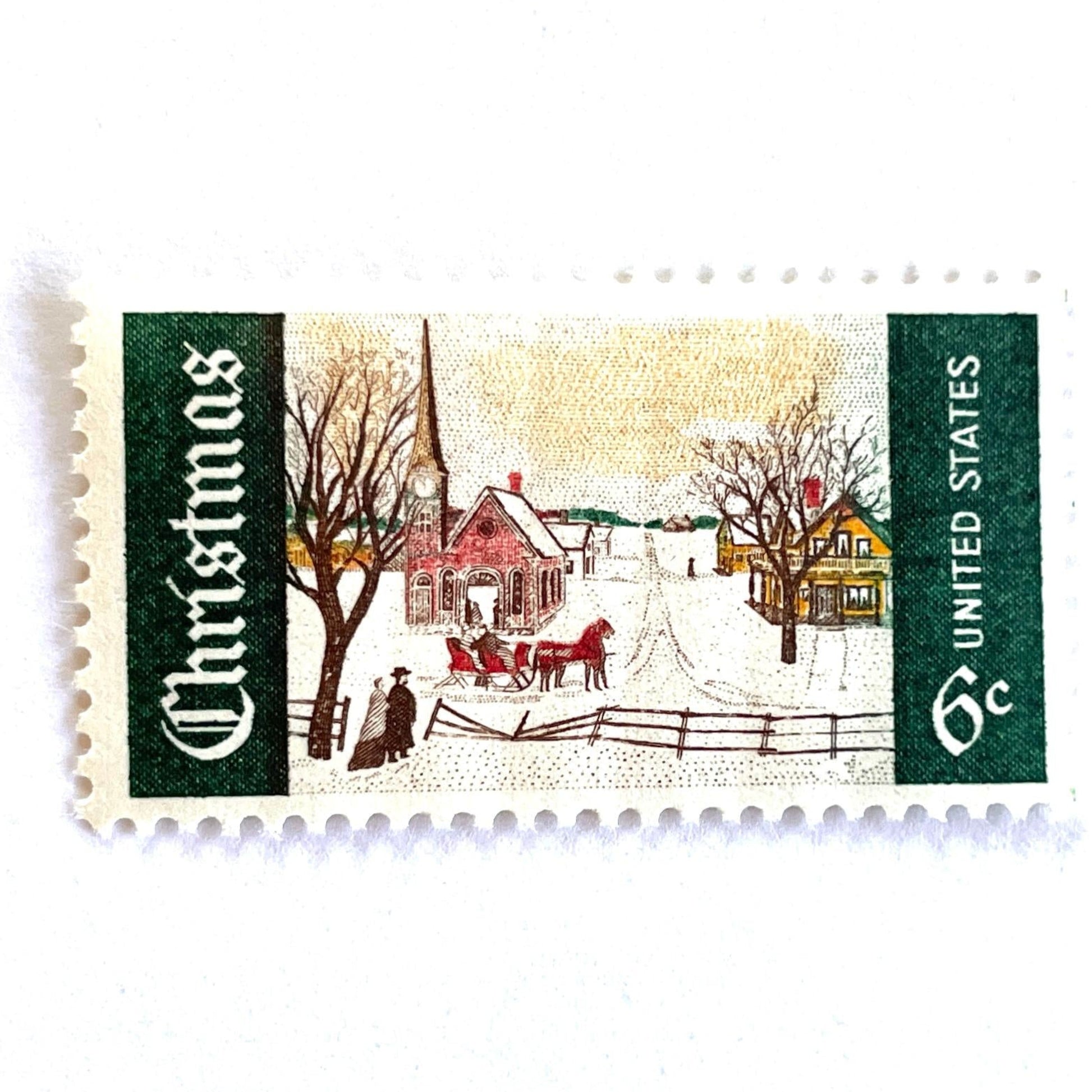 Image of 1969 Christmas Issue “Winter Sunday in Norway, Maine” 6-cent stamps. Scott #1384. Stamp Themes: Christmas, Holidays, Winter, Snow, Village, Sleigh, New England. Green and white postage stamp.