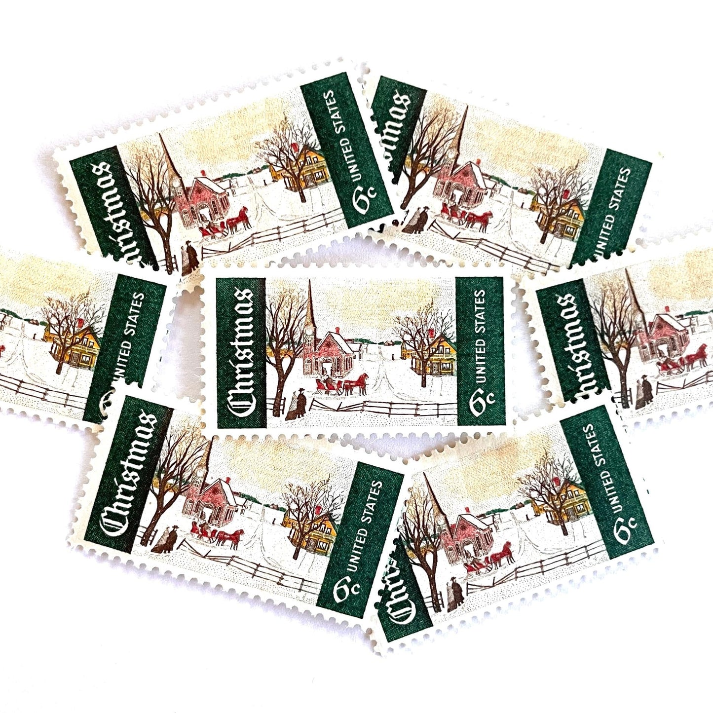 Image of 1969 Christmas Issue “Winter Sunday in Norway, Maine” 6-cent stamps. Scott #1384. Stamp Themes: Christmas, Holidays, Winter, Snow, Village, Sleigh, New England. Green and white postage stamp.