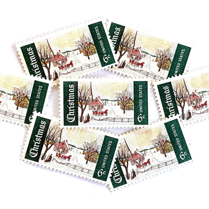 Image of 1969 Christmas Issue “Winter Sunday in Norway, Maine” 6-cent stamps. Scott #1384. Stamp Themes: Christmas, Holidays, Winter, Snow, Village, Sleigh, New England. Green and white postage stamp.