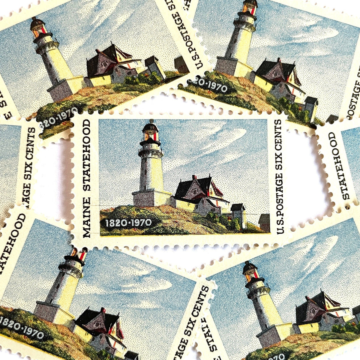 Image of Maine Statehood postage stamps from 1970, featuring Edward Hopper’s Lighthouse at Two Lights, Maine painting on vintage unused 6-cent USPS postage, Scott 1391.