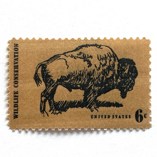 Image of 1970 Wildlife Conservation Bison Buffalo 6 cent stamps. Scott #1392. Stamp themes: Bison, Buffalo, Ecology, Range Animals, Wild West, Western, University of Colorado, Ralphie, Tatanka, Western Wedding, Yellowstone National Park. Grand Tetons National Park, Prairie. Brown postage stamp.