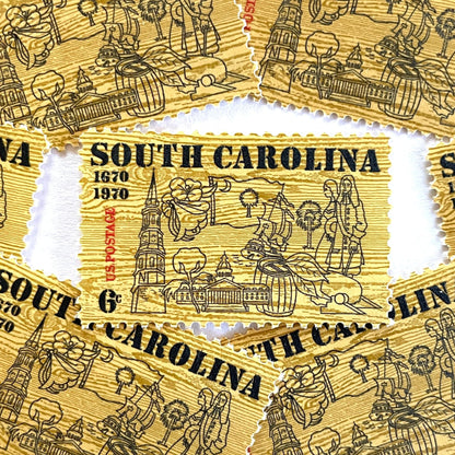 Image of South Carolina Tercentenary postage stamps from 1970, featuring a pine wood background and line drawings representing South Carolina history on vintage unused 6-cent USPS postage, Scott 1407.