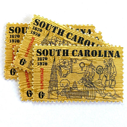 Image of South Carolina Tercentenary postage stamps from 1970, featuring a pine wood background and line drawings representing South Carolina history on vintage unused 6-cent USPS postage, Scott 1407.