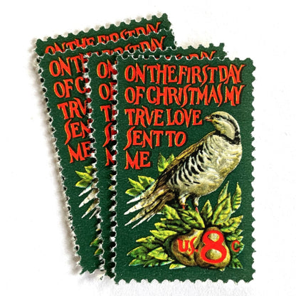 Image of 1971 Contemporary Christmas “Partridge in a Pear Tree” 8 cent stamps. Scott #1445. Stamp Themes: Christmas songs, Christmas carols, Holidays, Birds, Fruit, Partridge in a Pear Tree, The 12 Days of Christmas, on the first day of Christmas my true love sent to me. Red and green postage stamp.