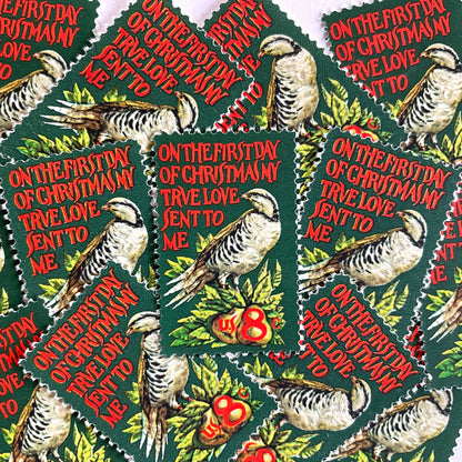 Image of 1971 Contemporary Christmas “Partridge in a Pear Tree” 8 cent stamps. Scott #1445. Stamp Themes: Christmas songs, Christmas carols, Holidays, Birds, Fruit, Partridge in a Pear Tree, The 12 Days of Christmas, on the first day of Christmas my true love sent to me. Red and green postage stamp.
