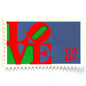 Red LOVE postage stamp from 1973 featuring Robert Indiana’s iconic red, green, and violet blue LOVE design on vintage unused 8-cent USPS postage, Scott 1475.