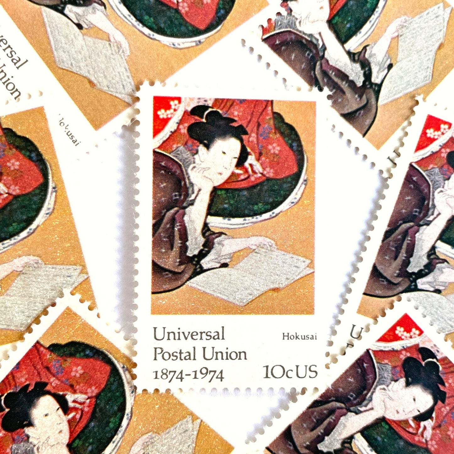 Image of 1974 Famous Works of Art Hokusai 10 cent stamps. Scott #1531. Japanese Art, Woodblock Art, Zen, 100th Anniversary Universal Postal Union, Five Feminine Virtues, artist Katsushika Hokusai, Reading, Kabuki, Kimono. Asian inspired postage stamp.