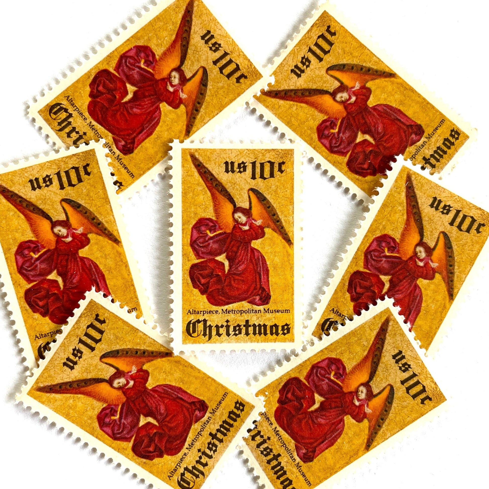 Image of 1974 Traditional Christmas “Angel Altarpiece” 10-cent stamps. Scott #1550. Stamp Themes: Christmas, Holidays, Religious, Altar, Angel, Angel Wings, The Met, Metropolitan Museum of Art, NYC, New York. Red, gold postage stamp.