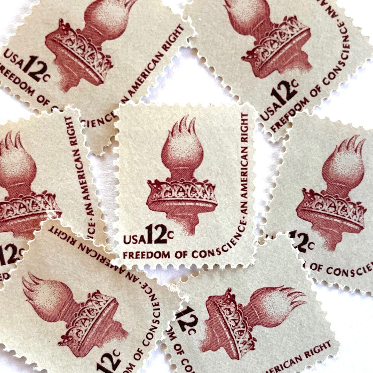 Image of 1981 Americana Series “Statue of Liberty Torch” 12-cent mail stamps. Scott #1594. Stamp Themes: Statue of Liberty, Lady Liberty, Torch, Light, NYC, New York City, Freedom of Conscience, An American Right Immigration. Red/brown postage stamp.