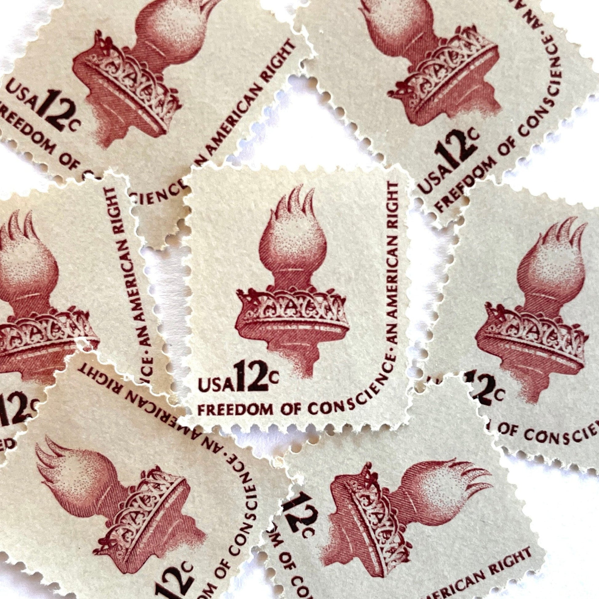 Image of 1981 Americana Series “Statue of Liberty Torch” 12-cent mail stamps. Scott #1594. Stamp Themes: Statue of Liberty, Lady Liberty, Torch, Light, NYC, New York City, Freedom of Conscience, An American Right Immigration. Red/brown postage stamp.