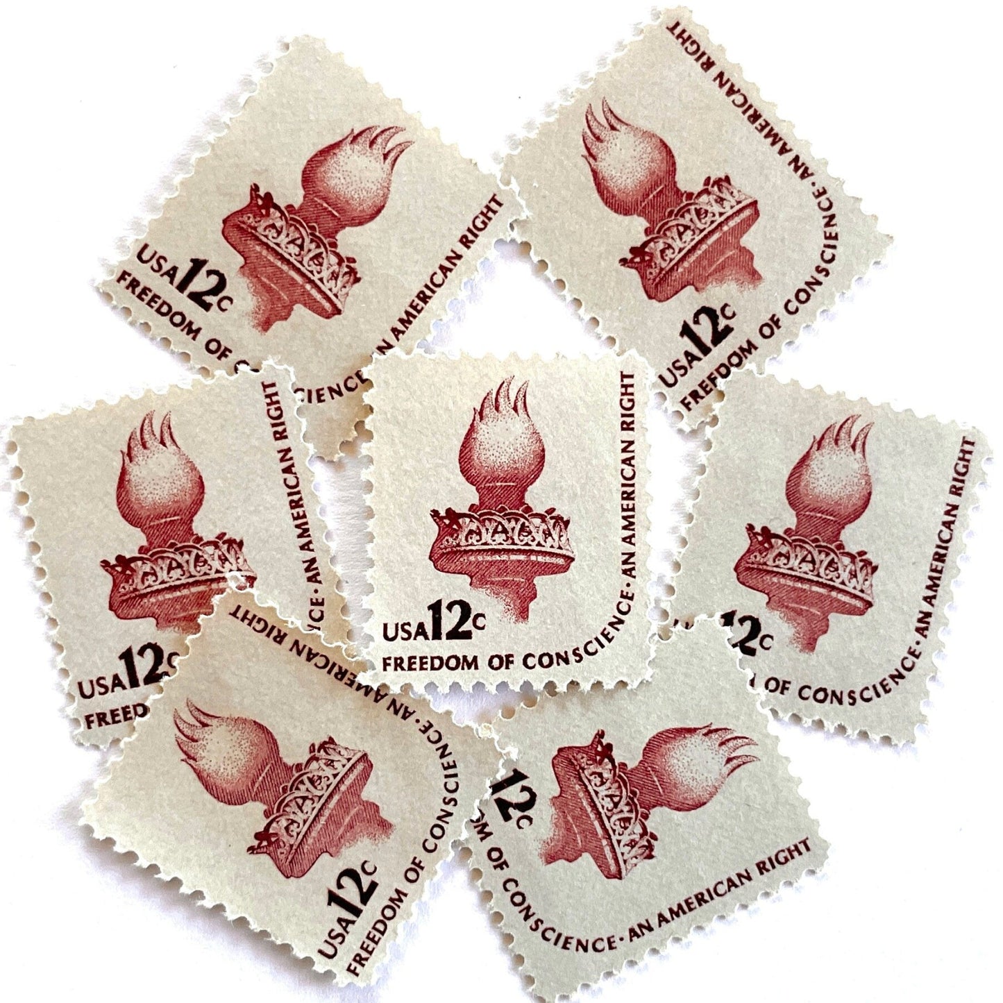 Image of 1981 Americana Series “Statue of Liberty Torch” 12-cent mail stamps. Scott #1594. Stamp Themes: Statue of Liberty, Lady Liberty, Torch, Light, NYC, New York City, Freedom of Conscience, An American Right Immigration. Red/brown postage stamp.