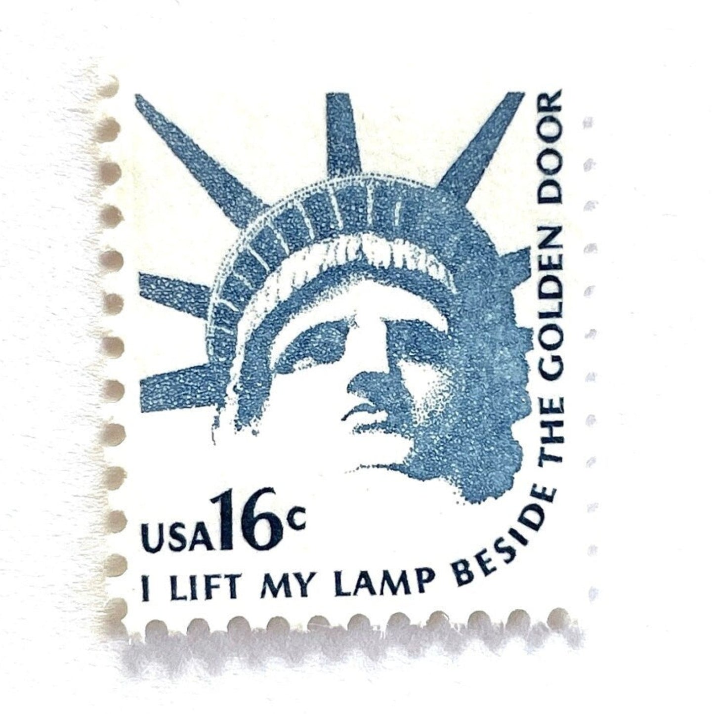 Image of 1978 Americana Series “Statue of Liberty” 16-cent mail stamps. Scott #1599. Stamp Themes: Statue of Liberty, Lady Liberty, NYC, New York City, Immigration. Blue postage stamp.