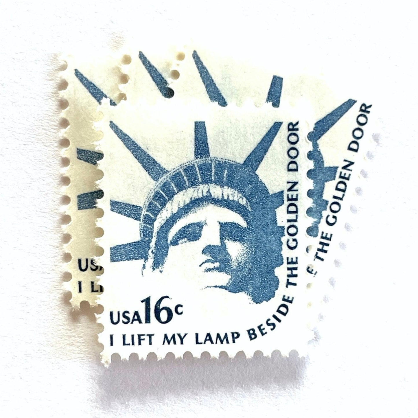 Image of 1978 Americana Series “Statue of Liberty” 16-cent mail stamps. Scott #1599. Stamp Themes: Statue of Liberty, Lady Liberty, NYC, New York City, Immigration. Blue postage stamp.