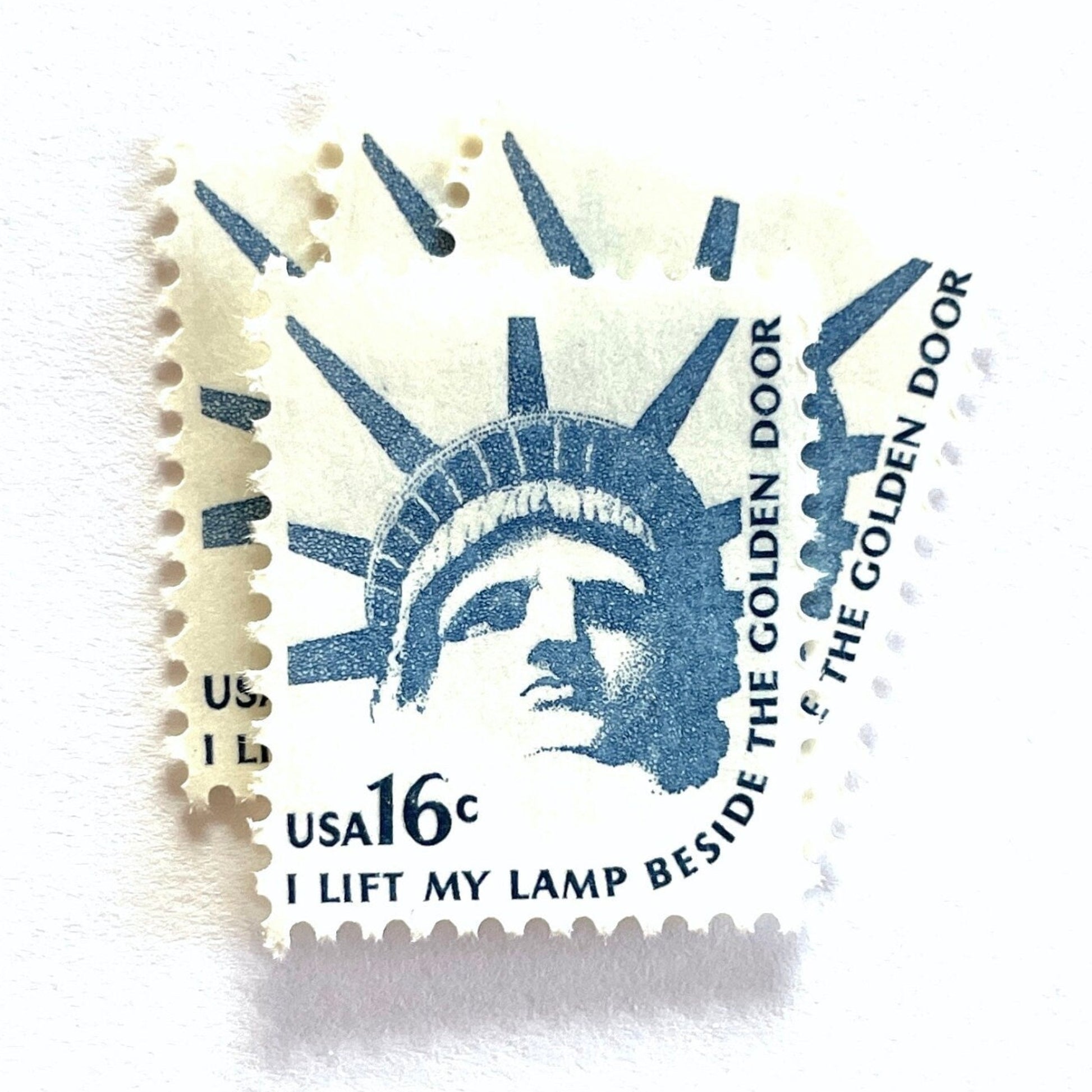 Image of 1978 Americana Series “Statue of Liberty” 16-cent mail stamps. Scott #1599. Stamp Themes: Statue of Liberty, Lady Liberty, NYC, New York City, Immigration. Blue postage stamp.