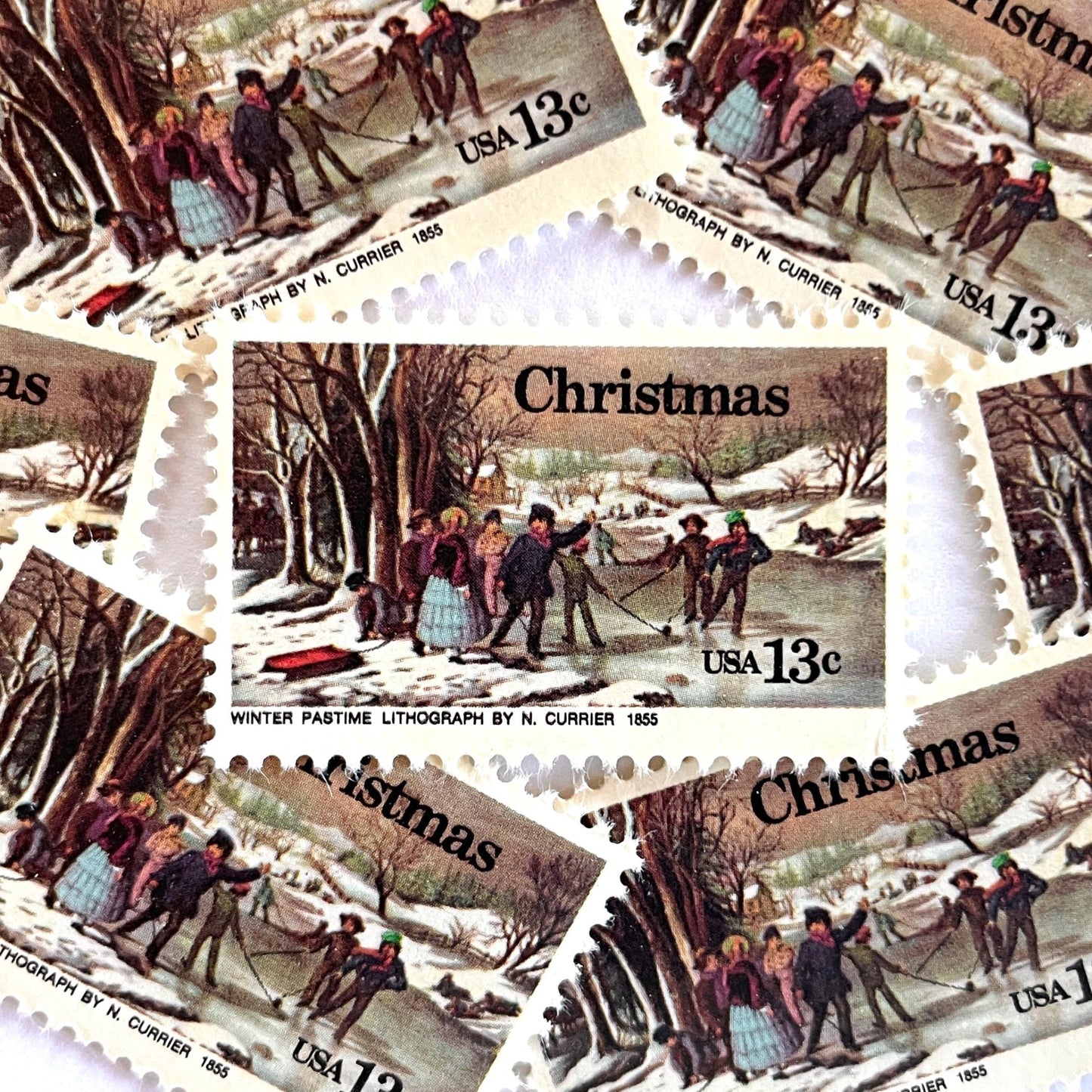 Image of 1976 Contemporary Christmas “Currier's Winter Pastime” 13-cent stamps. Scott #1702. Stamp Themes: Holidays, Winter Scene, Snow, Ice Skating, Artist Nathaniel Currier. Multicolored postage stamp.