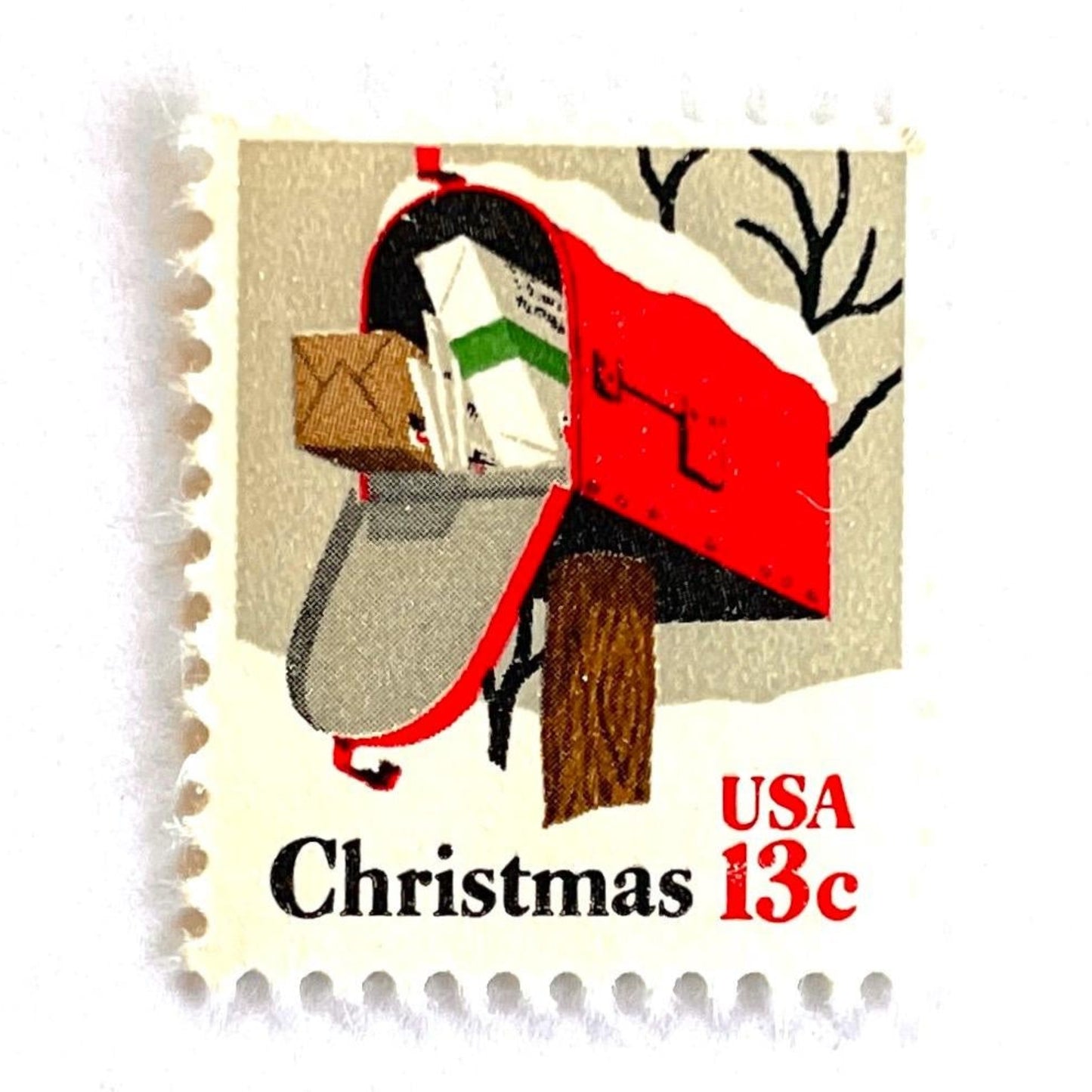 Image of 1977 Contemporary Christmas “Rural Mailbox” 32-cent stamps. Scott #1730. Stamp Themes: Mailbox, Christmas Mail, Christmas Parcels, Christmas Cards, Snow, Rural America. Red and white postage stamp.