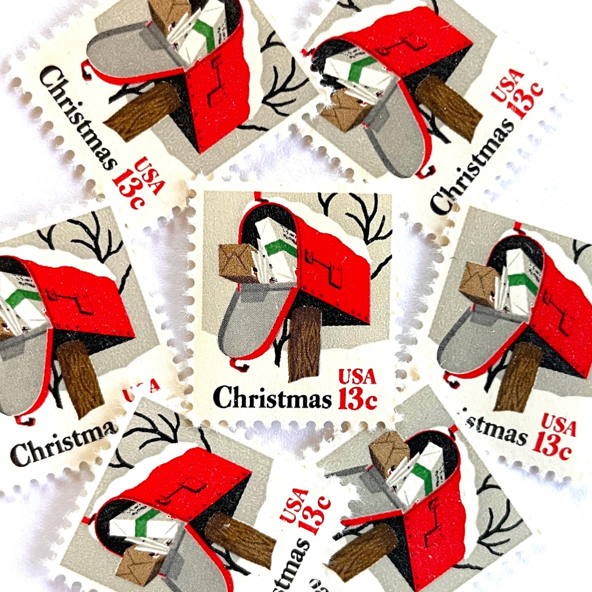 Image of 1977 Contemporary Christmas “Rural Mailbox” 32-cent stamps. Scott #1730. Stamp Themes: Mailbox, Christmas Mail, Christmas Parcels, Christmas Cards, Snow, Rural America. Red and white postage stamp.
