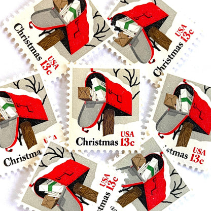 Image of 1977 Contemporary Christmas “Rural Mailbox” 32-cent stamps. Scott #1730. Stamp Themes: Mailbox, Christmas Mail, Christmas Parcels, Christmas Cards, Snow, Rural America. Red and white postage stamp.