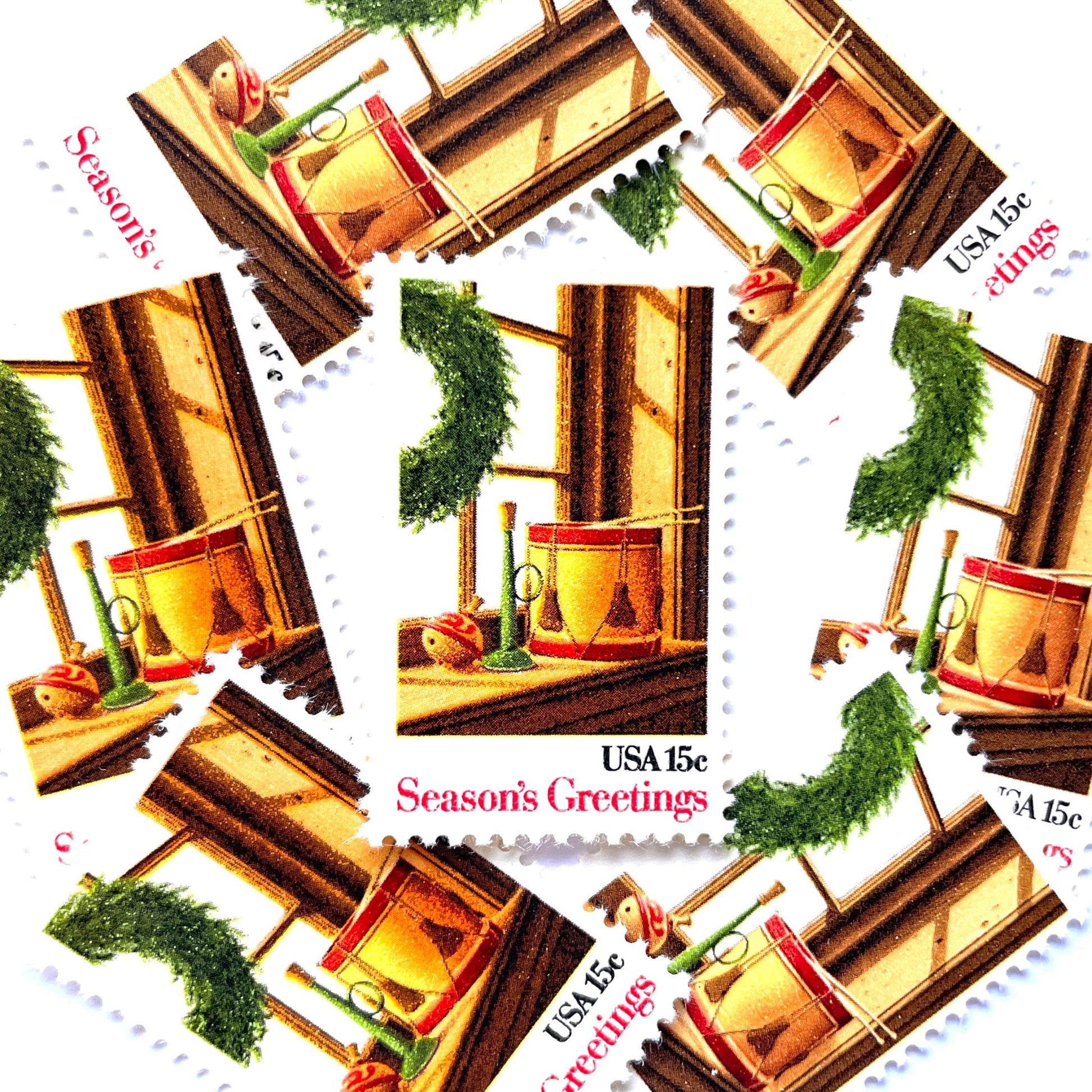 Image of 1980 Contemporary Christmas “Wreath and Toys on Window” 15-cent stamps. Scott #1843. Stamp Themes: Christmas, Holidays, Toys, Musical Instruments, Drum, Horn, Spinning Top. Multicolored postage stamp.