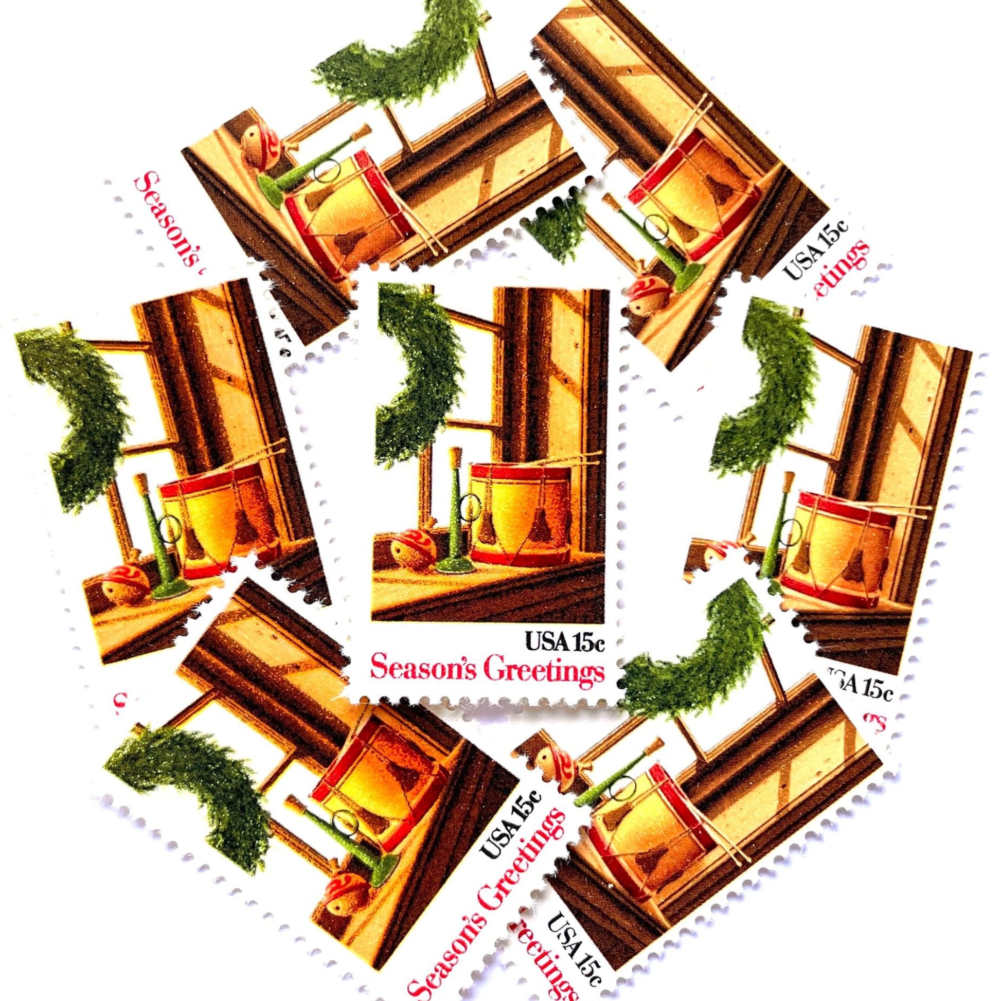 Image of 1980 Contemporary Christmas “Wreath and Toys on Window” 15-cent stamps. Scott #1843. Stamp Themes: Christmas, Holidays, Toys, Musical Instruments, Drum, Horn, Spinning Top. Multicolored postage stamp.