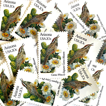 Image of Arizona State Bird and Flower postage stamps from 1982, featuring a Cactus Wren and Saguaro cactus blossom on vintage unused 20-cent USPS postage, Scott 1955.