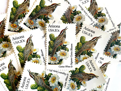 Image of Arizona State Bird and Flower postage stamps from 1982, featuring a Cactus Wren and Saguaro cactus blossom on vintage unused 20-cent USPS postage, Scott 1955.