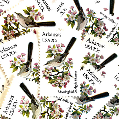 Image of Arkansas State Bird and Flower postage stamps from 1982, featuring a Mockingbird and Apple Blossom on vintage unused 20-cent USPS postage, Scott 1956.