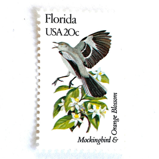 Image of Florida State Bird and Flower postage stamps from 1982, featuring a Mockingbird and Orange Blossom on vintage unused 20-cent USPS postage, Scott 1961.
