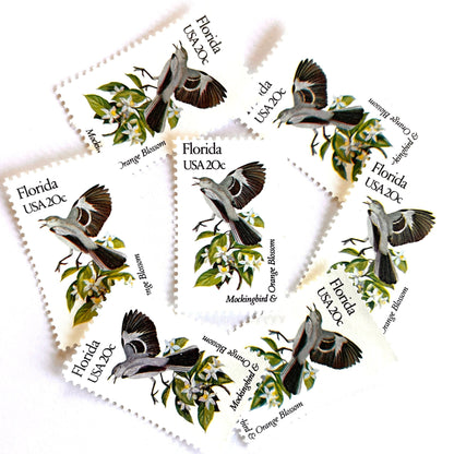 Image of Florida State Bird and Flower postage stamps from 1982, featuring a Mockingbird and Orange Blossom on vintage unused 20-cent USPS postage, Scott 1961.