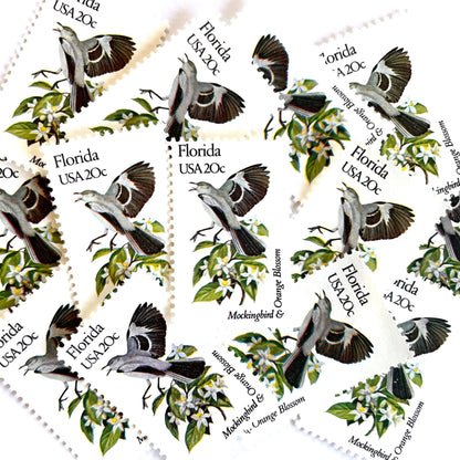 Image of Florida State Bird and Flower postage stamps from 1982, featuring a Mockingbird and Orange Blossom on vintage unused 20-cent USPS postage, Scott 1961.