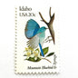 Image of Idaho State Bird and Flower postage stamps from 1982, featuring a Mountain Bluebird and Syringa on vintage unused 20-cent USPS postage, Scott 1964.