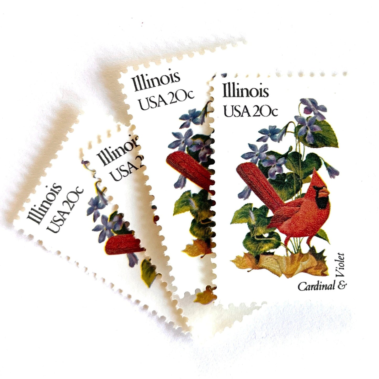 Image of Illinois State Bird and Flower postage stamps from 1982, featuring a Cardinal and Violet on vintage unused 20-cent USPS postage, Scott 1965.