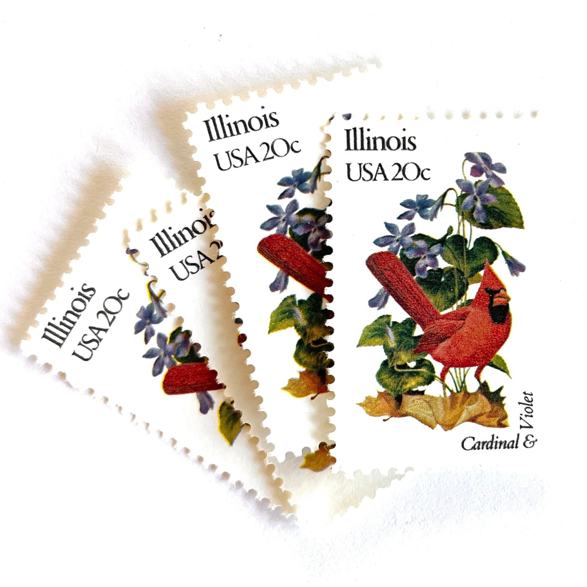 Image of Illinois State Bird and Flower postage stamps from 1982, featuring a Cardinal and Violet on vintage unused 20-cent USPS postage, Scott 1965.