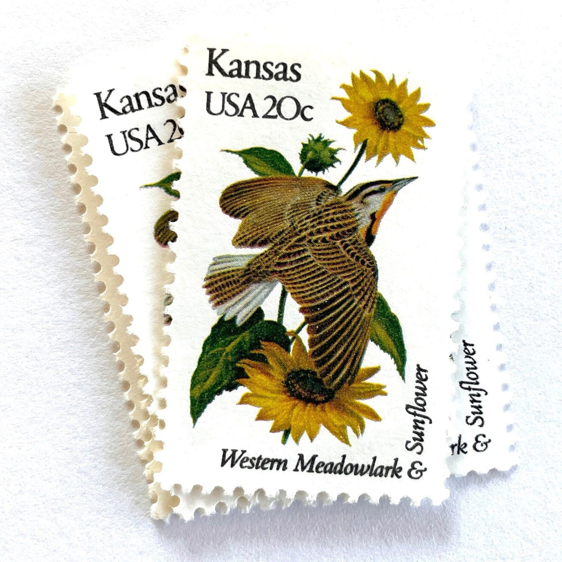 Image of Kansas State Bird and Flower postage stamps from 1982, featuring a Western Meadowlark and Sunflower on vintage unused 20-cent USPS postage, Scott 1968.