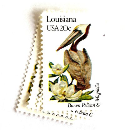 Image of Louisiana State Bird and Flower postage stamps from 1982, featuring a Brown Pelican and Magnolia on vintage unused 20-cent USPS postage, Scott 1970.