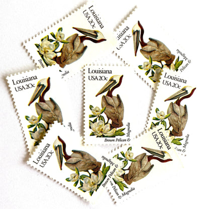 Image of Louisiana State Bird and Flower postage stamps from 1982, featuring a Brown Pelican and Magnolia on vintage unused 20-cent USPS postage, Scott 1970.