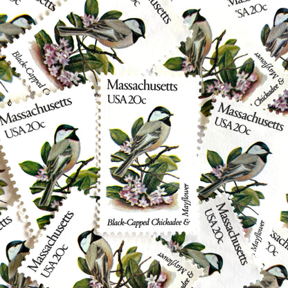 Image of Massachusetts State Bird and Flower postage stamps from 1982, featuring a Black-Capped Chickadee and Mayflower on vintage unused 20-cent USPS postage, Scott 1973.
