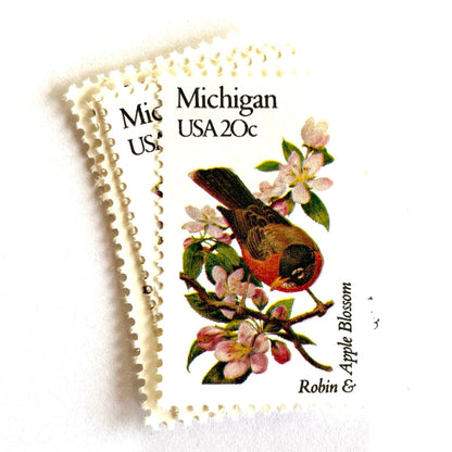 Image of Michigan State Bird and Flower postage stamps from 1982, featuring a Robin and Apple Blossom on vintage unused 20-cent USPS postage, Scott 1974.