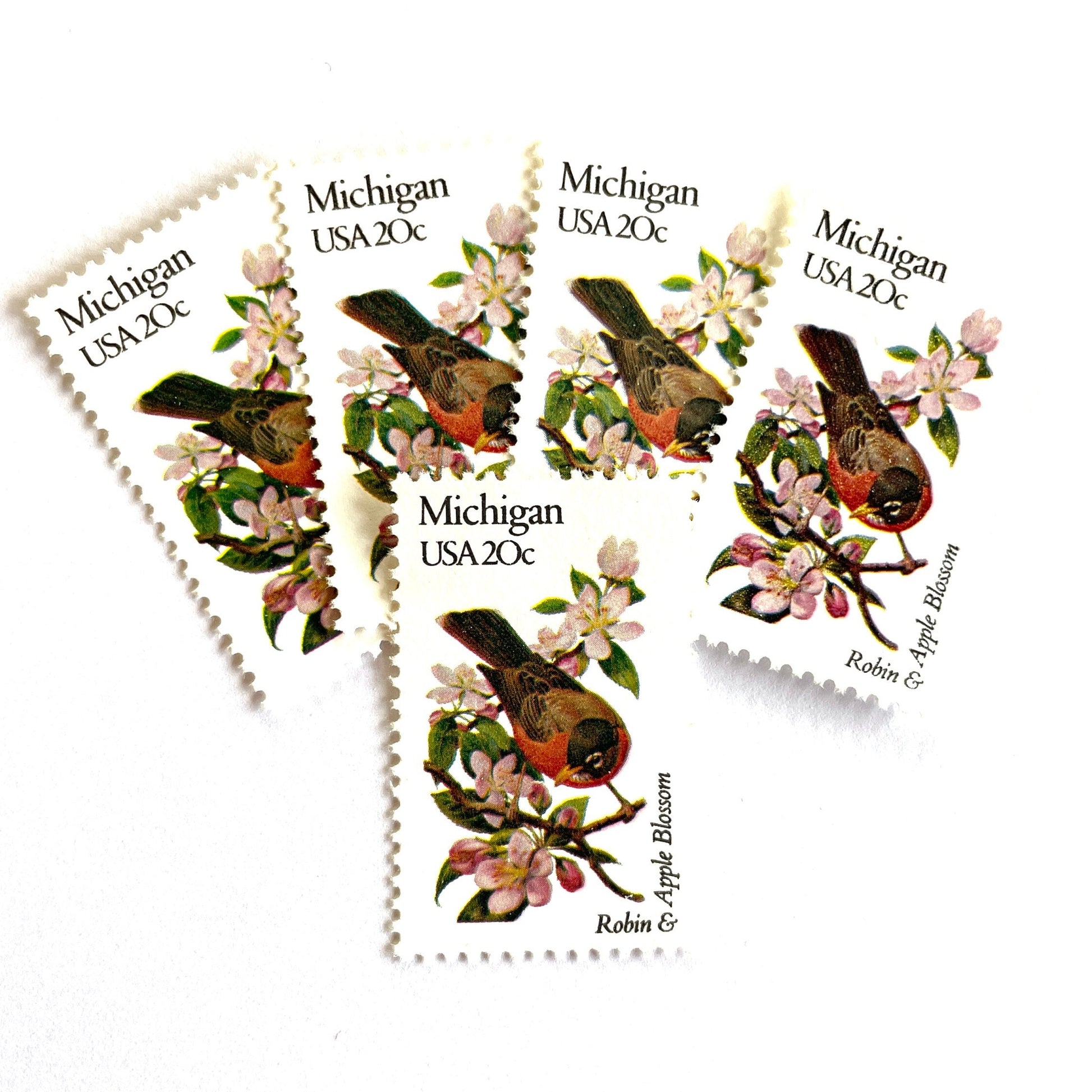 Image of Michigan State Bird and Flower postage stamps from 1982, featuring a Robin and Apple Blossom on vintage unused 20-cent USPS postage, Scott 1974.