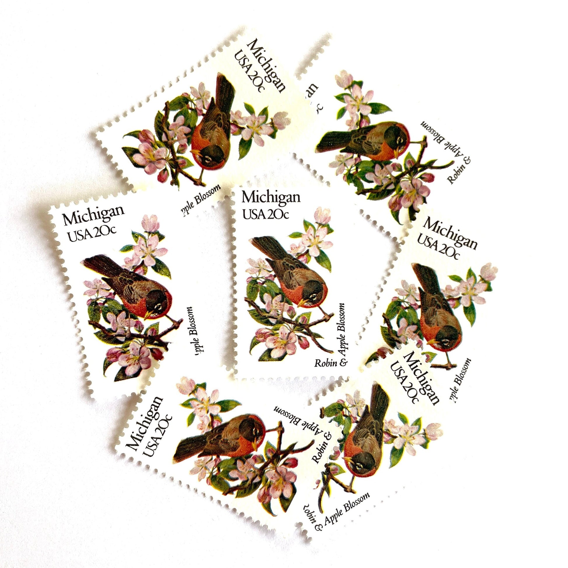 Image of Michigan State Bird and Flower postage stamps from 1982, featuring a Robin and Apple Blossom on vintage unused 20-cent USPS postage, Scott 1974.