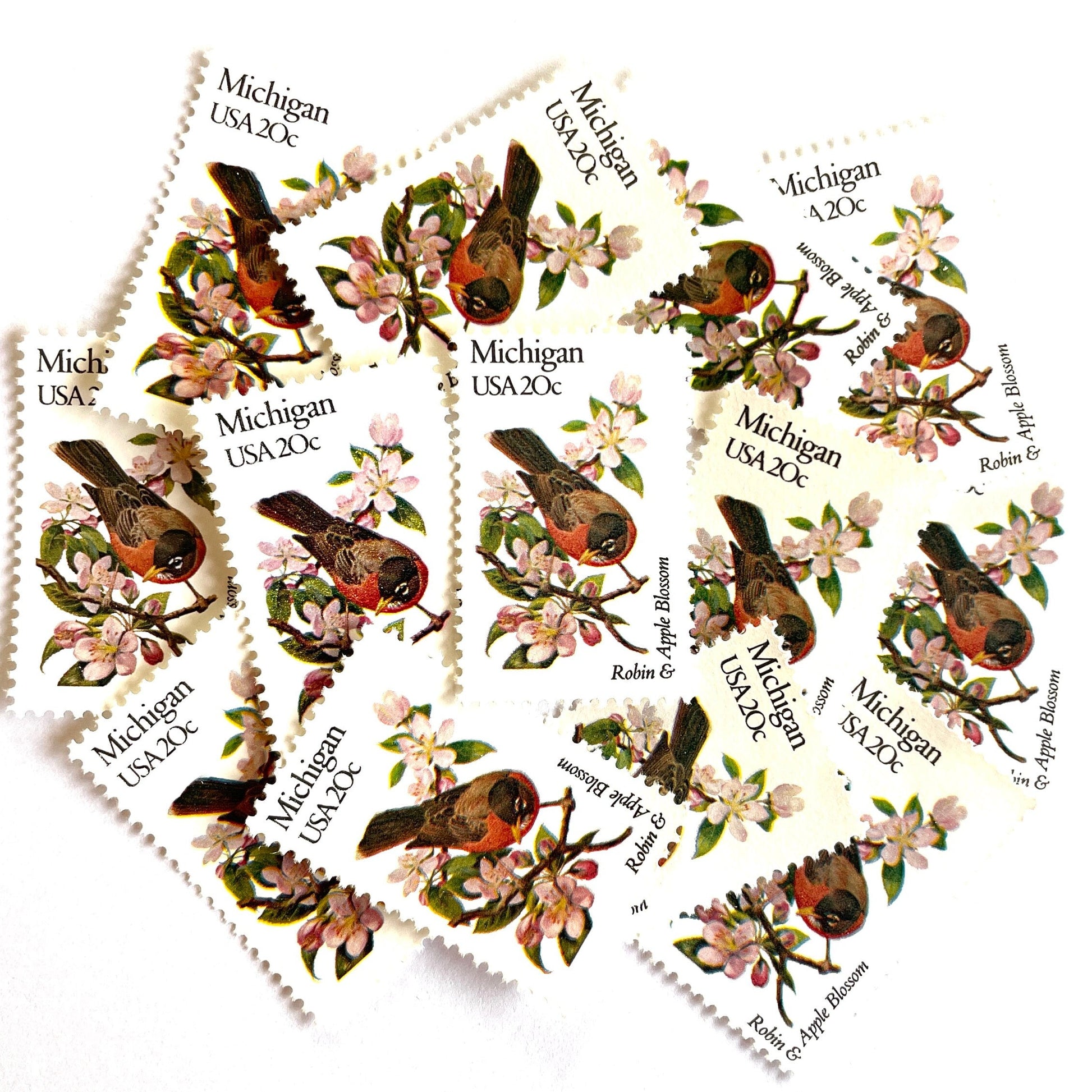 Image of Michigan State Bird and Flower postage stamps from 1982, featuring a Robin and Apple Blossom on vintage unused 20-cent USPS postage, Scott 1974.