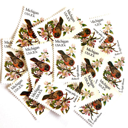 Image of Michigan State Bird and Flower postage stamps from 1982, featuring a Robin and Apple Blossom on vintage unused 20-cent USPS postage, Scott 1974.