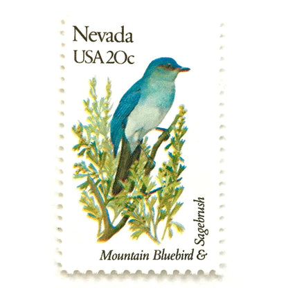 Image of Nevada State Bird and Flower postage stamps from 1982, featuring a Mountain Bluebird and Sagebrush on vintage unused 20-cent USPS postage, Scott 1980.