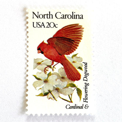 Image of North Carolina State Bird and Flower postage stamps from 1982, featuring a Cardinal and Flowering Dogwood on vintage unused 20-cent USPS postage, Scott 1985.