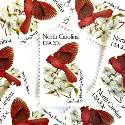 Image of North Carolina State Bird and Flower postage stamps from 1982, featuring a Cardinal and Flowering Dogwood on vintage unused 20-cent USPS postage, Scott 1985.