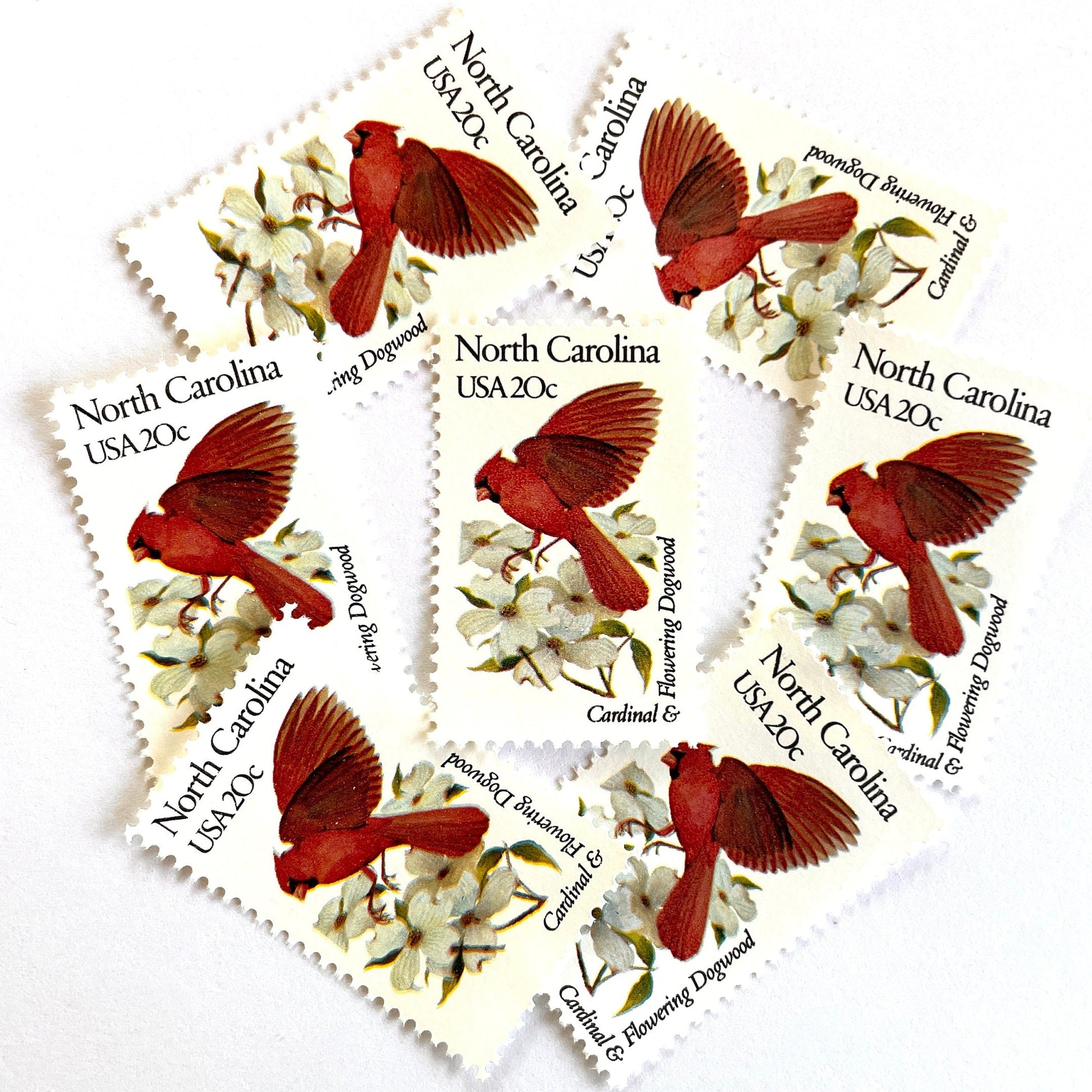 Image of North Carolina State Bird and Flower postage stamps from 1982, featuring a Cardinal and Flowering Dogwood on vintage unused 20-cent USPS postage, Scott 1985.
