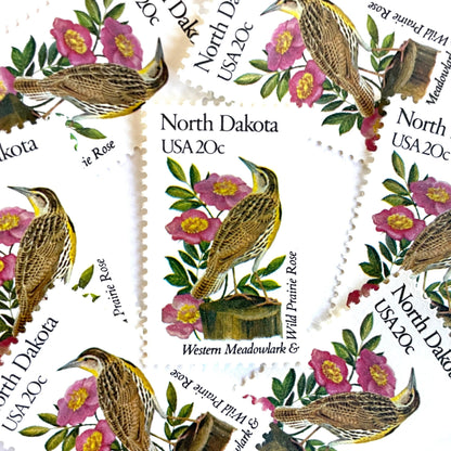 Image of North Dakota State Bird and Flower postage stamps from 1982, featuring a Western Meadowlark and Wild Prairie Rose on vintage unused 20-cent USPS postage, Scott 1986.